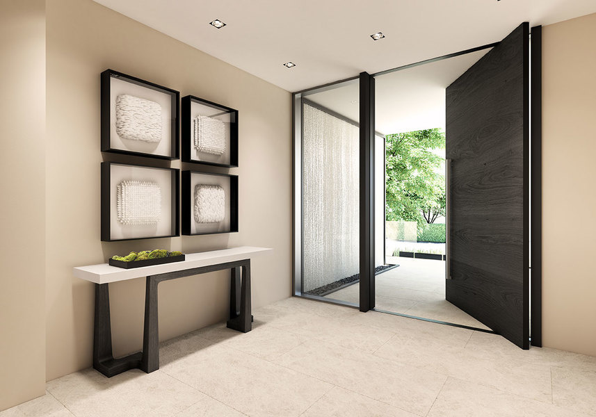 A streamlined console and bold sculptural elements make the entryway of this Eleven on Lenox Miami to