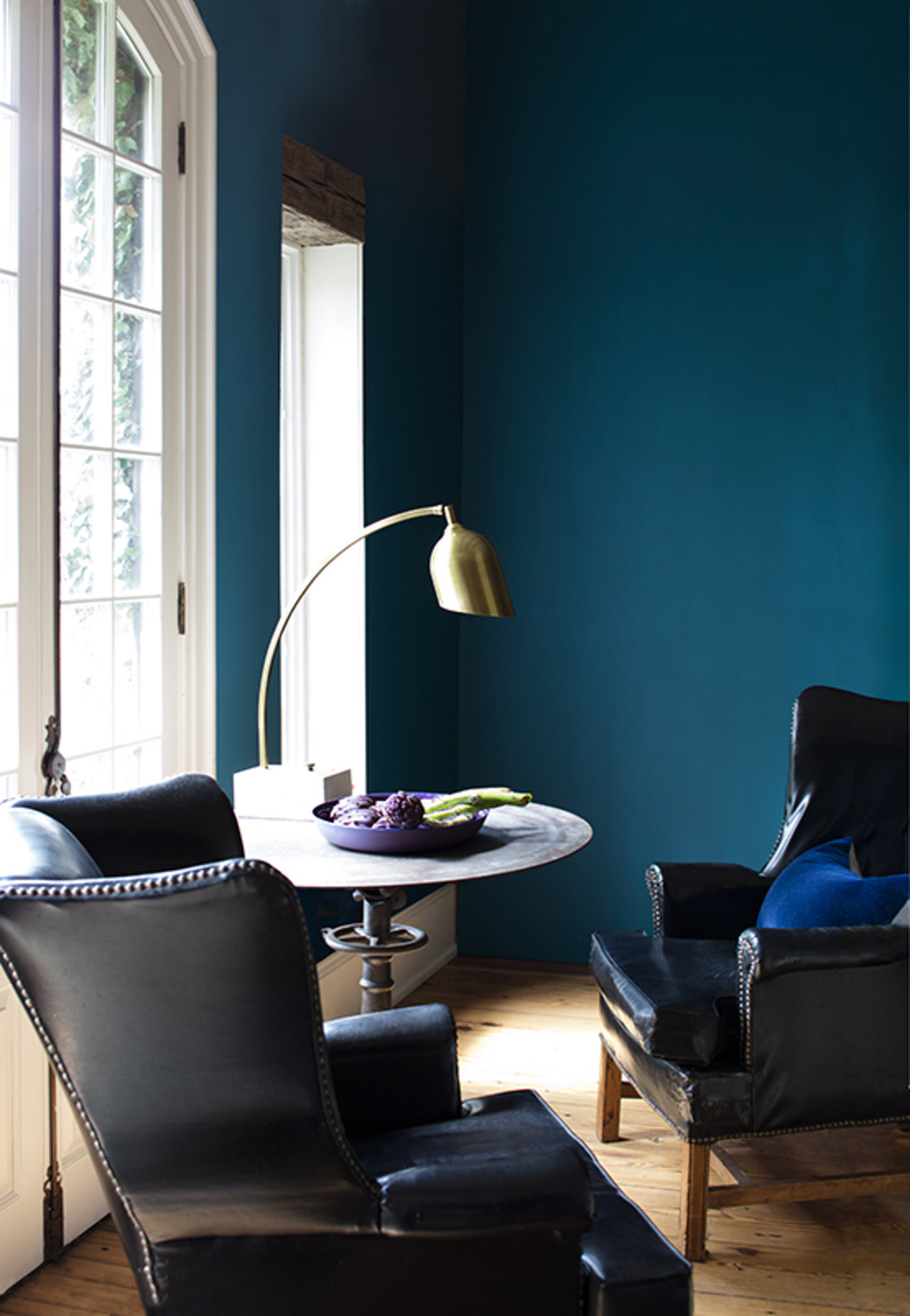 Cobalt blue Century paint has a velvet-like effect on the walls of a sitting room.