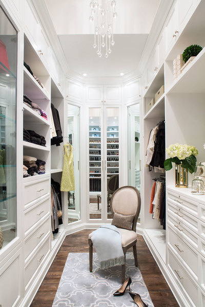 This closet designed by Lisa Adams of LA Closet Design maximizes space by using floor-to ceiling shel