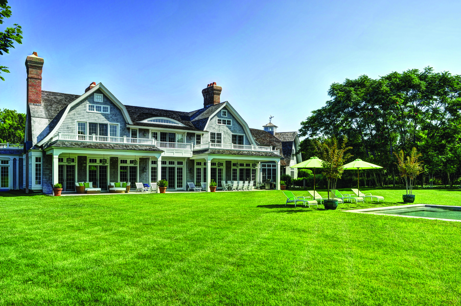 This two-story, 9,000 square-foot Gambrel-style home blends traditional luxury with the chic contempo