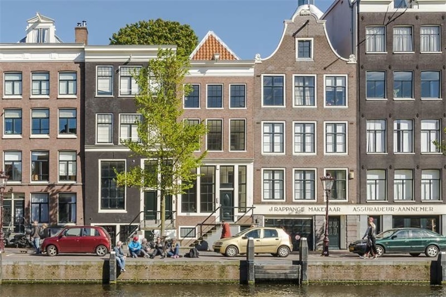 Pictured (middle) is a six-bedroom townhouse in the Canal Ring District, currently listed for sale at